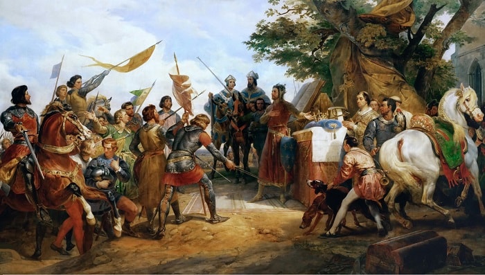 Bouvines Çarpışması başlarken Fransa Kralı Philippe August yanındaki sunağa konmuş bir tacı, savaşta en büyük kahramanlığı gösteren askere sunuyor / Magna Carta