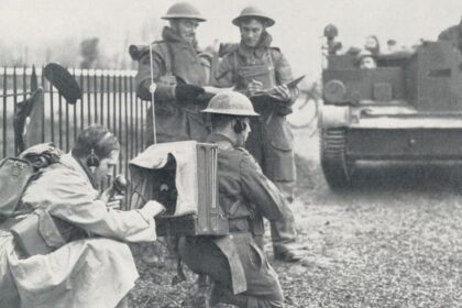 cropped British radio operator in the field war exercise min