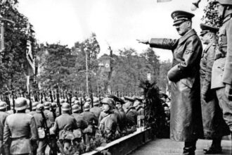 cropped scope ambitions Adolf Hitler troops photograph Germany 1938 min