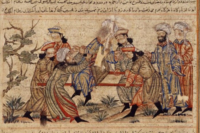 14. el yazmasında beyaz sarıklı bir haşhaşi (solda) Nizamülmülk'e suikast düzenliyor. İnsanların yüzleri daha sonradan kazınmış