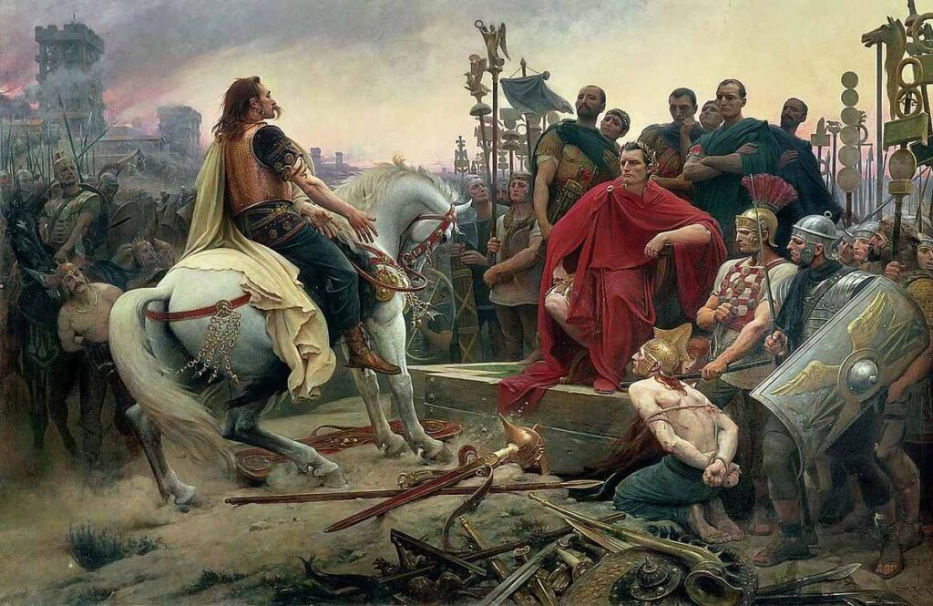 At sırtındaki Vercingetorix kılıcını maiyetiyle çevrili oturan Sezar'a teslim eder. Resim, Alesia Savaşı'ndan (MÖ 52) sonra Galyalı şefin teslim olmasını tasvir ediyor.